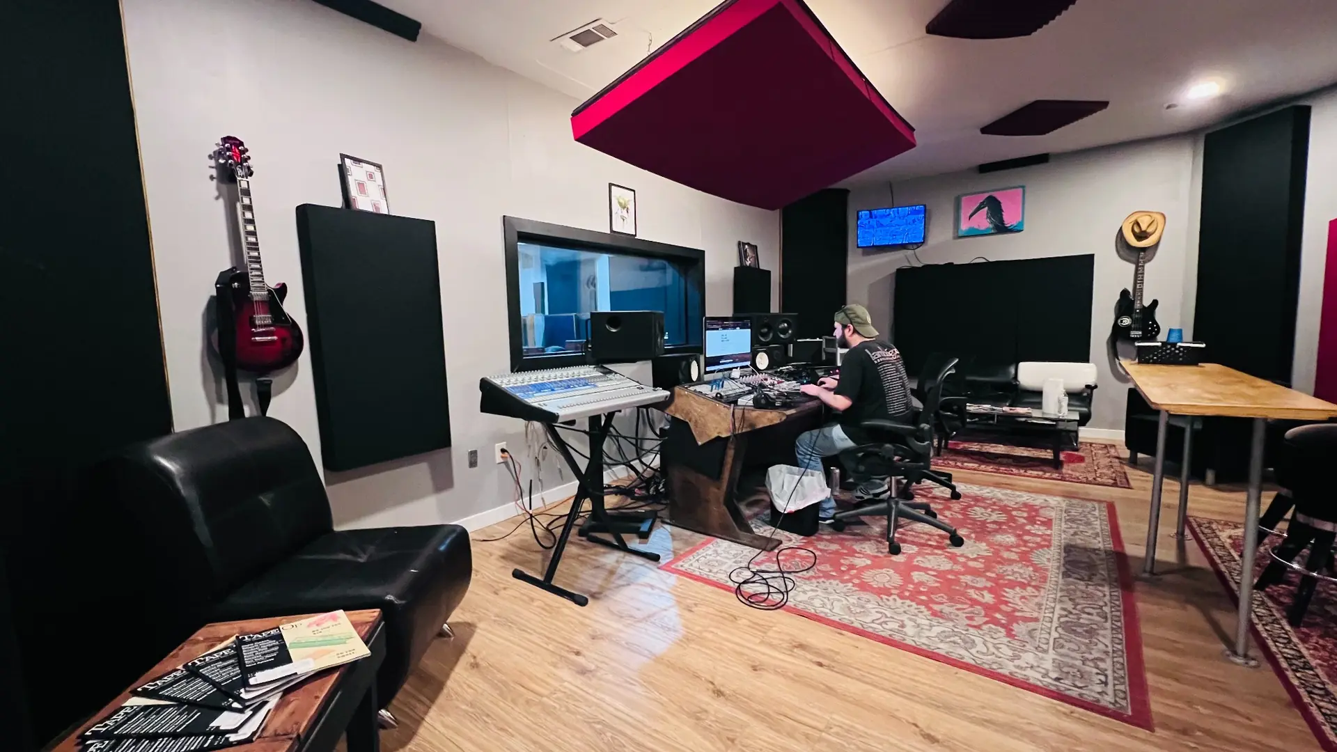 Wide view of EMP Studio A’s control room with an engineer at the console