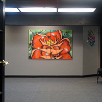 Pic of double doors in center of Country Club Ln Fort Worth Facility and artwork on wall.