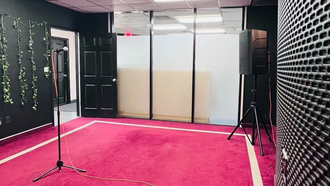 Medium hourly rehearsal room at EMP with open floor space and a microphone setup