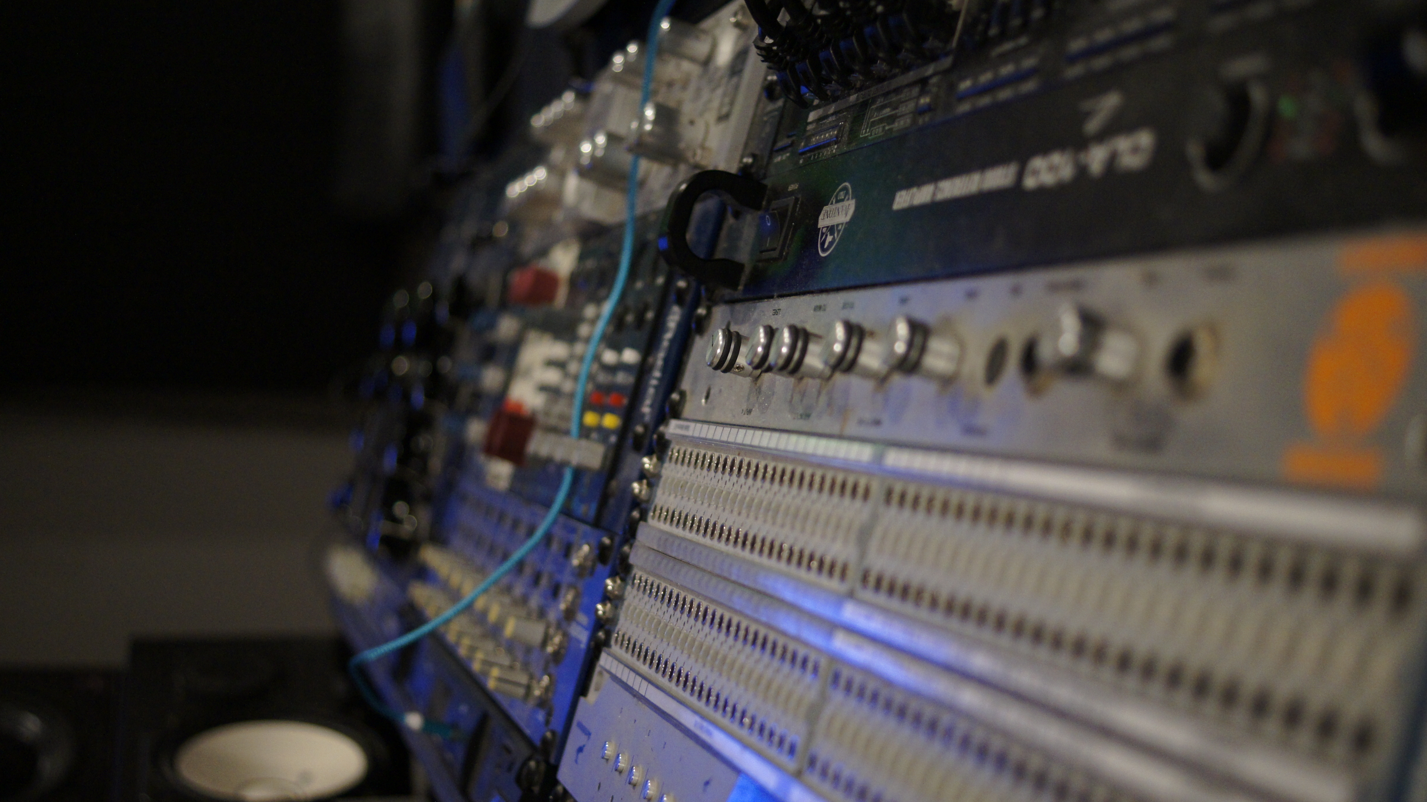 Photo of a the patchbay and mixing desk in control room of EMP Studio A.