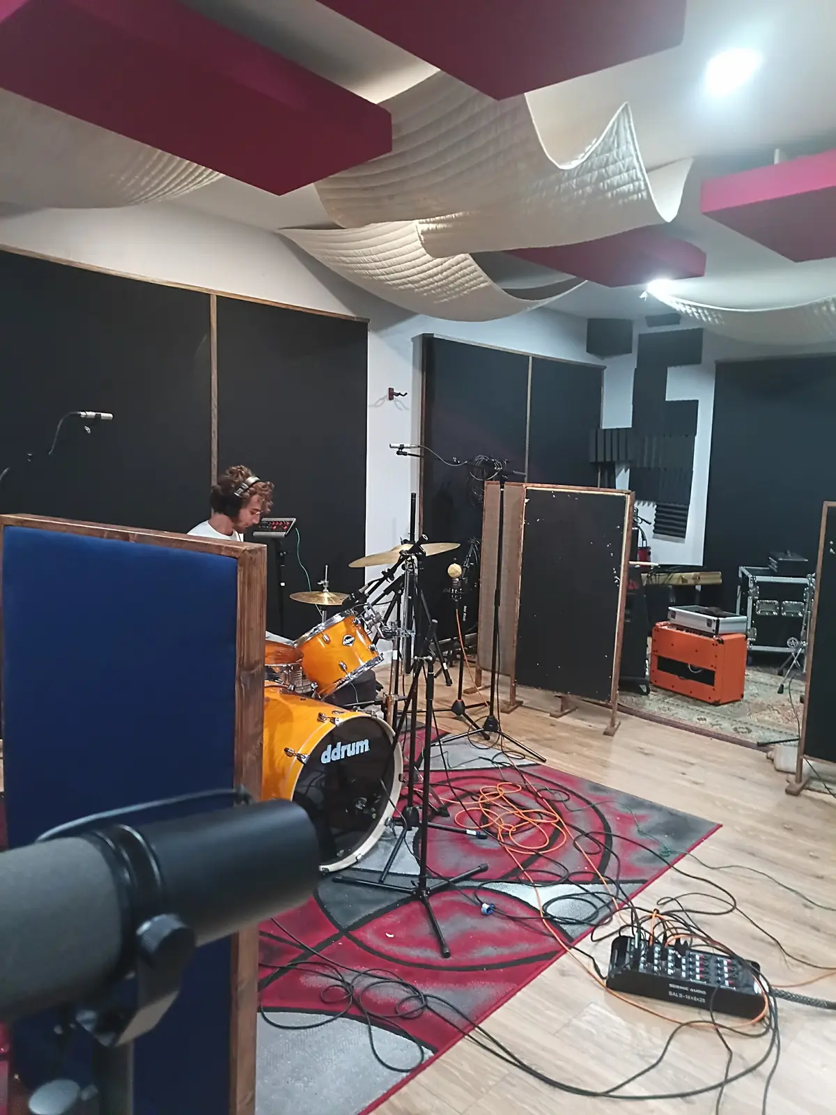 Drummer tracking in EMP Studio A behind acoustic gobos and close microphones